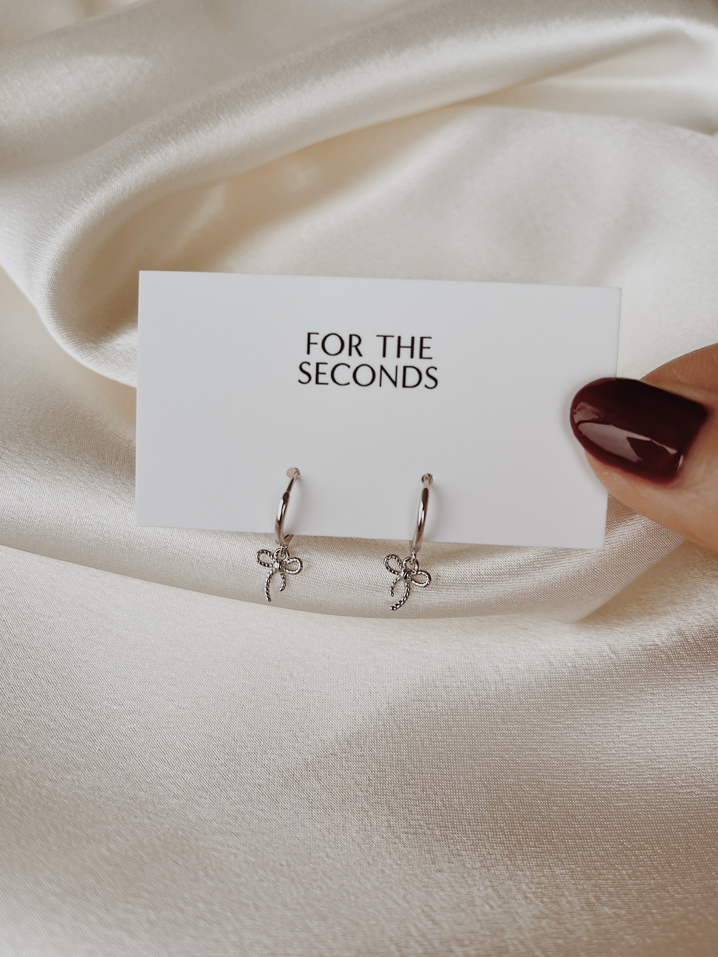 bow earrings | silver