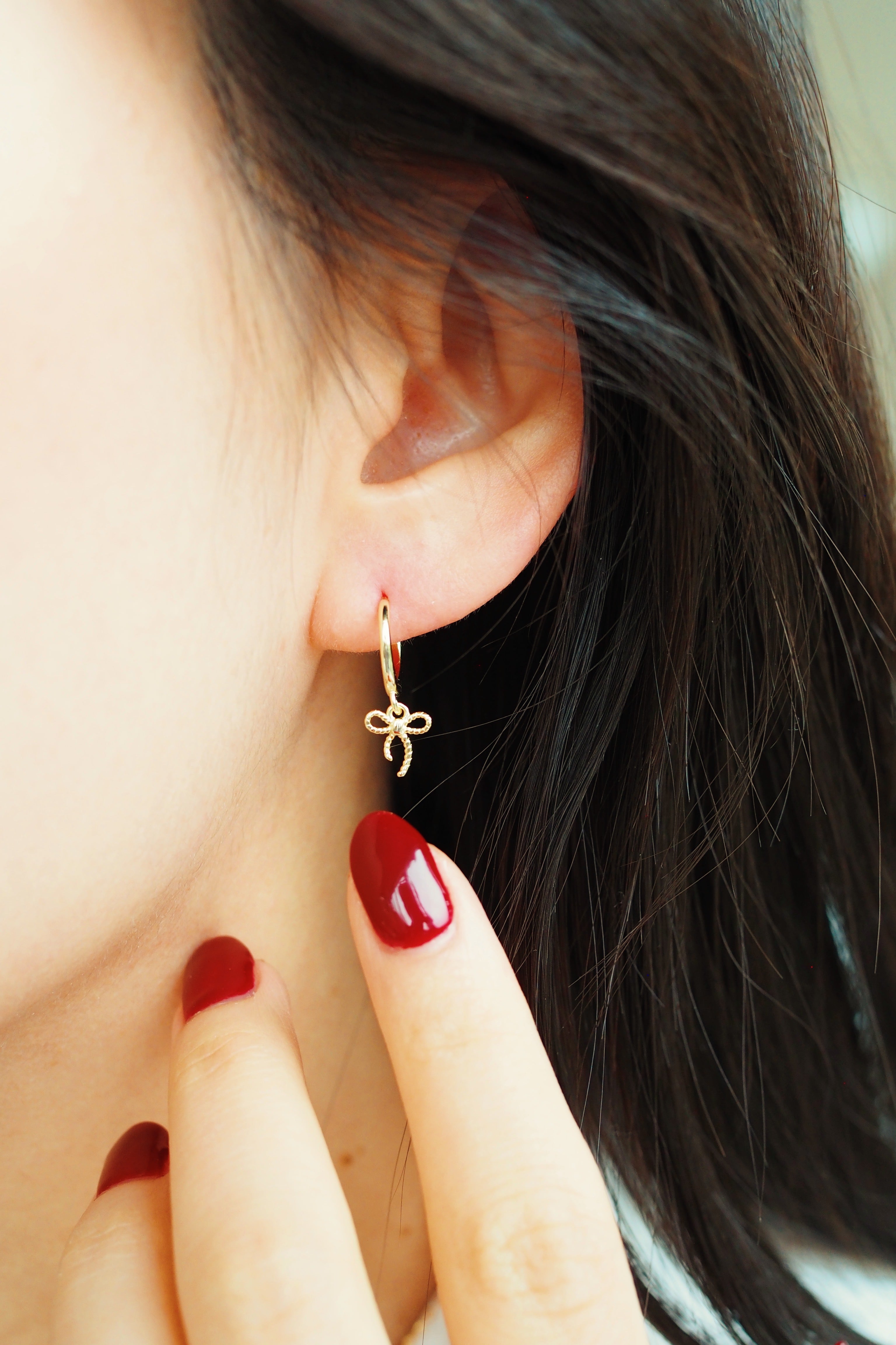 bow earrings | gold